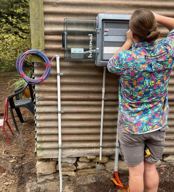 AusEco electrician working on a switchboard in Adelaide Hills